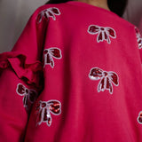 Daily Brat Shimmer Bow Sweater Love Potion